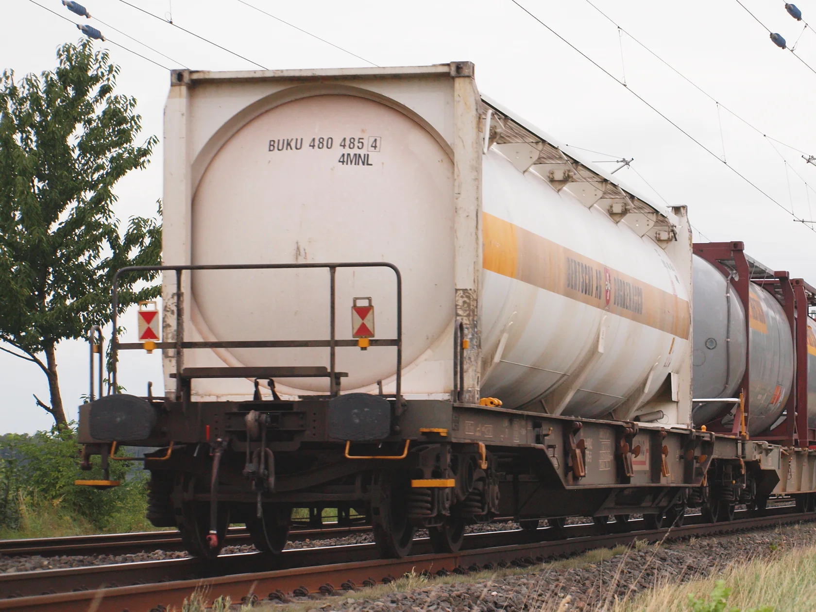 Industry photograph of tank containers carried on rail wagons.